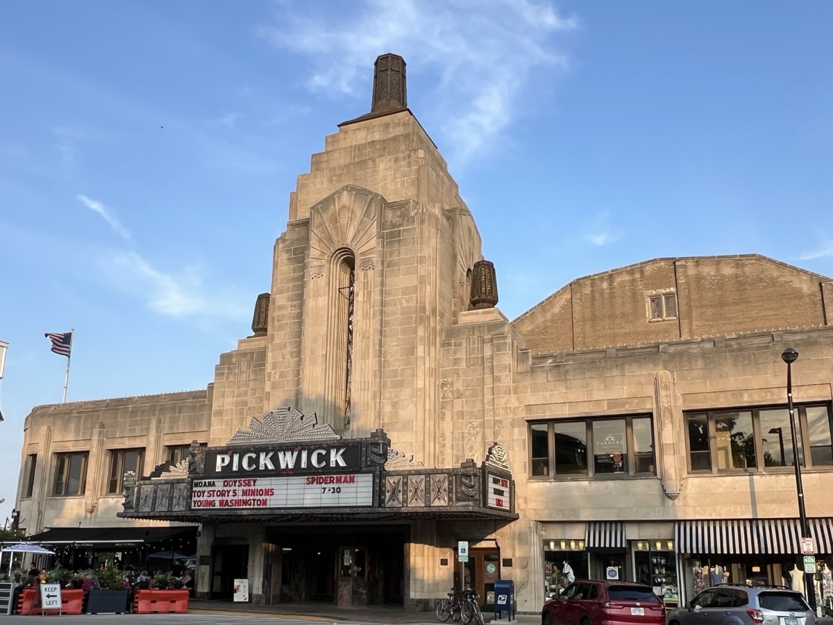 The Pickwick Theatre tower and marquee in Uptown Park Ridge, Illinois on a summer evening